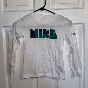 Boys Nike White Long Sleeve Tshirt. Size large (6/7 years).